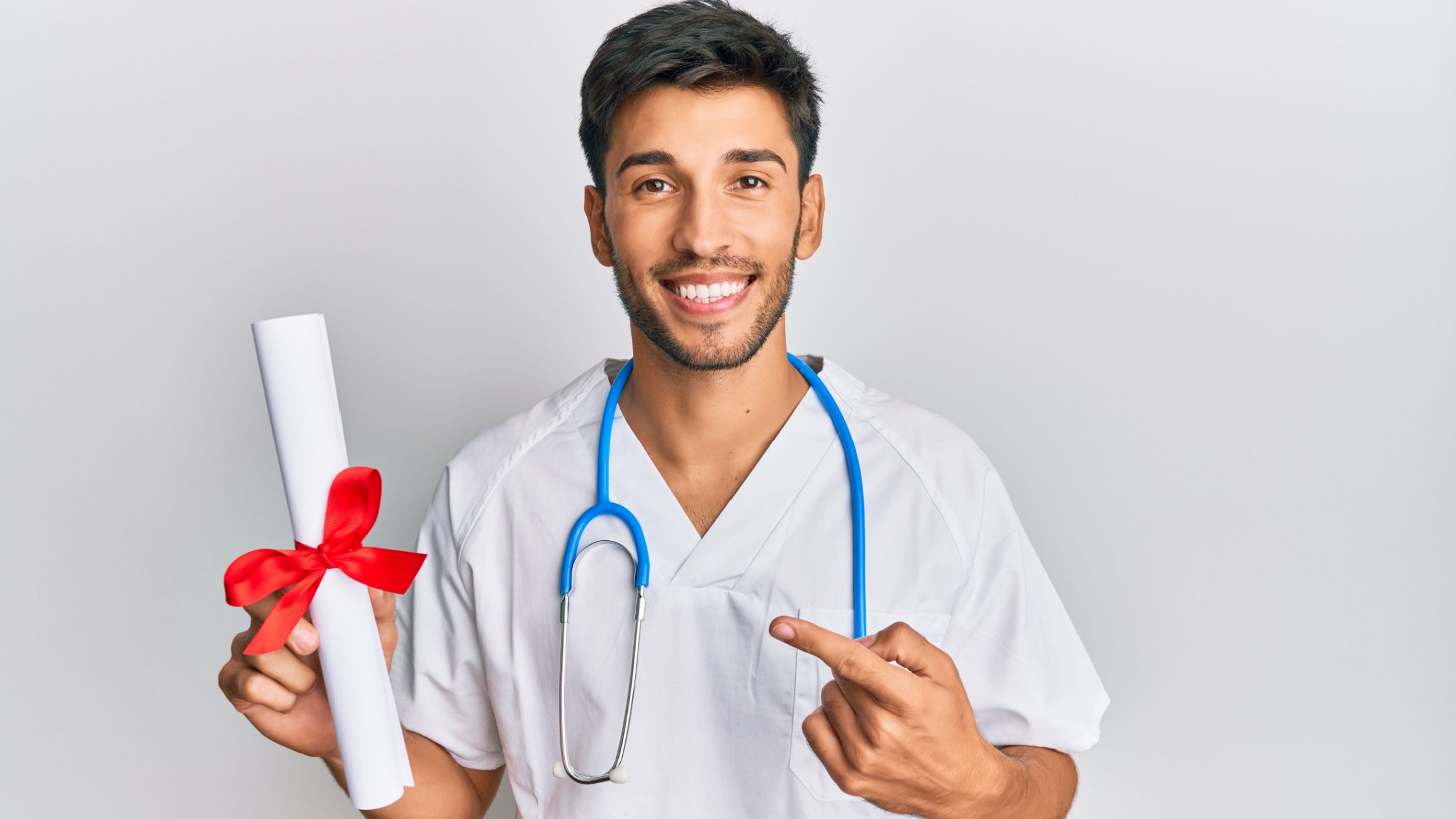 A doctor holding his MD certification after having passed USMLE Step 3.